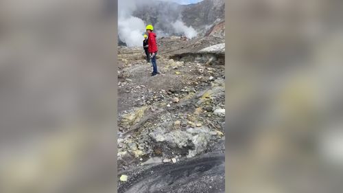 Tourists were videoed exploring the crater while gas poured from the ground. 