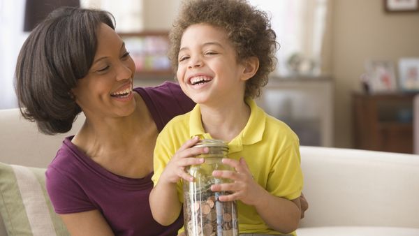 Mother and son holding money 