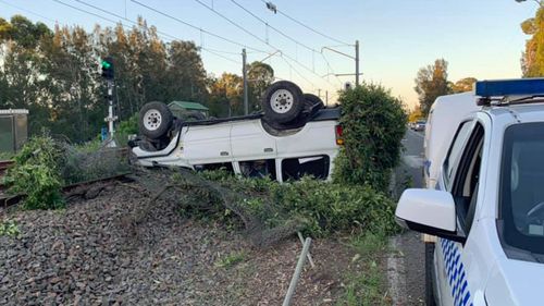 High-range 'drink driver' rolls 4WD onto train tracks at Lake Macquarie