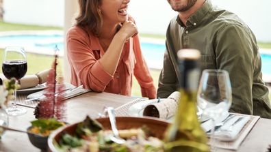 A couple sitting down for a meal on Christmas day