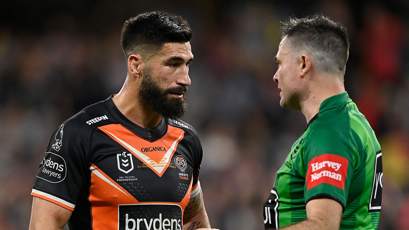 James Tamou of the Tigers speaks with referee Chris Butler.
