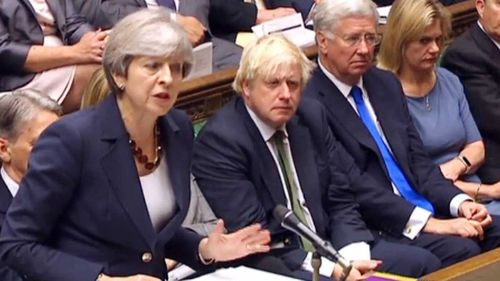 Besieged May passes first parliament test