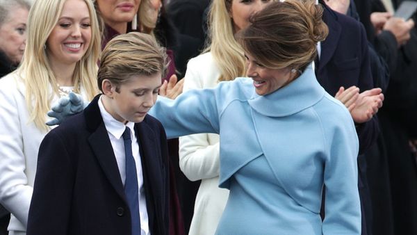Melania Trump keeps Baron close at Trump's inauguration