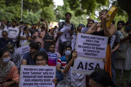 Activists hold placards as they participate in a protest demonstration against remission of sentence by the government to convicts of a gang rape of a Muslim woman, in New Delhi, India, Saturday, August 27, 2022.  