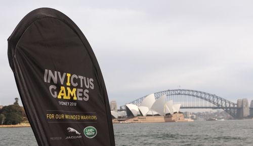 An Invictus games banner is seen in front of the Sydney Opera House and Harbour Bridge during the ticket launch for the Invictus Games Sydney 2018. Picture: AAP