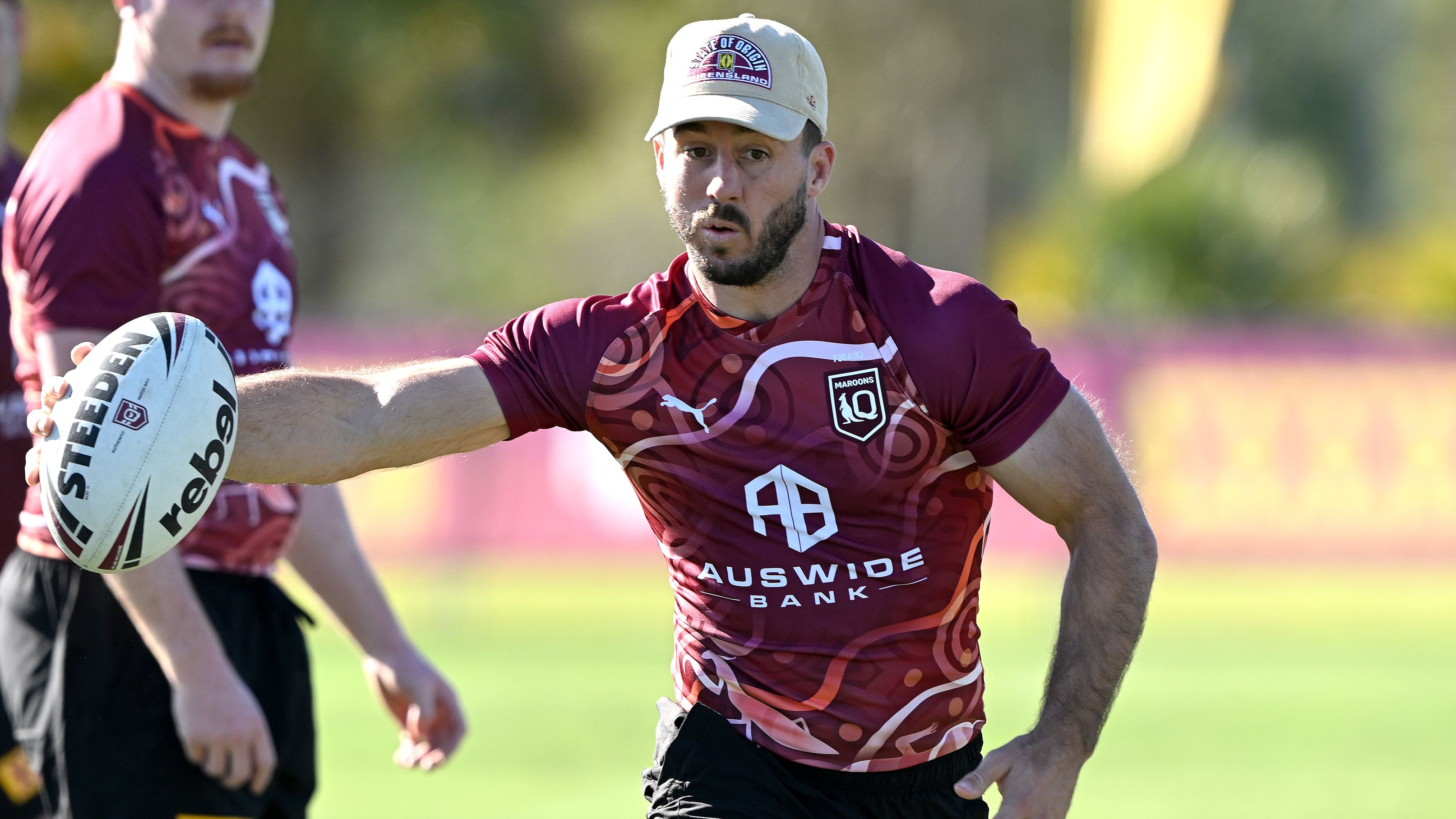 GOLD COAST, AUSTRALIA - JUNE 15: Ben Hunt runs with the ball during a Queensland Maroons State of Origin training session at Sanctuary Cove on June 15, 2023 in Gold Coast, Australia. (Photo by Bradley Kanaris/Getty Images)