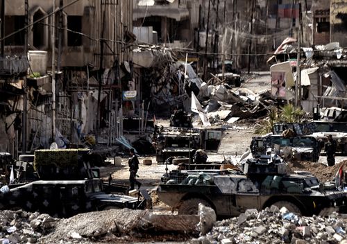 A picture shows a general view of Mosul as Iraqi troops battle against Islamic State (IS) group fighters to further advance inside the city, on March 7, 2017. 