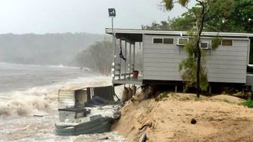 Part of a home on Great Keppel Island is collapsing into the see as Cyclone Marcia pounds its barricades away. (Supplied)