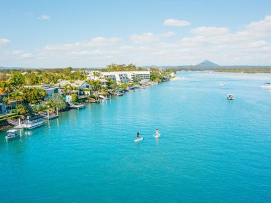 Paddle boarders on the Noosa River.