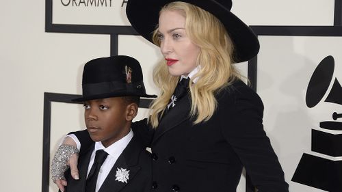 Madonna and son, David Banda, at the 56th annual Grammy Awards in 2014. (AAP)