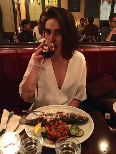 Dinner in Paris with a glass of red after a long day of appointments.