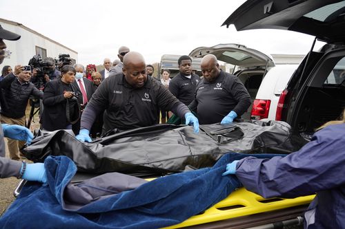 Bettersten Wade watches her son's body moved