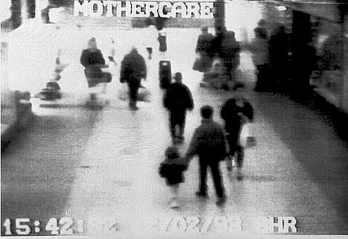 Video camera shows two-year-old James Bulger holding the hand of an unknown man. (AAP)