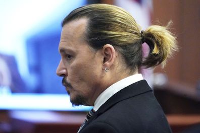 Actor Johnny Depp waits for the jury to come in the courtroom after a break, at the Fairfax County Circuit Courthouse in Fairfax, Va., Monday April 18, 2022. Depp sued his ex-wife Amber Heard for libel in Fairfax County Circuit Court after she wrote an op-ed piece in The Washington Post in 2018 referring to herself as a "public figure representing domestic abuse." (AP Photo/Steve Helber, Pool)