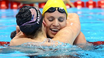 Emily Seebohm embraces Missy Franklin after the 100m backstroke final at the London Olympics.