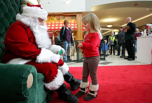 Traditional Santa stops are still a popular drawcard for many shopping centres (AP)