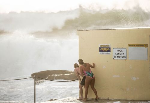 Brave beachgoers daring enough to face the strong swell were faced with offshore waves of up to nine metres in height yesterday (AAP).