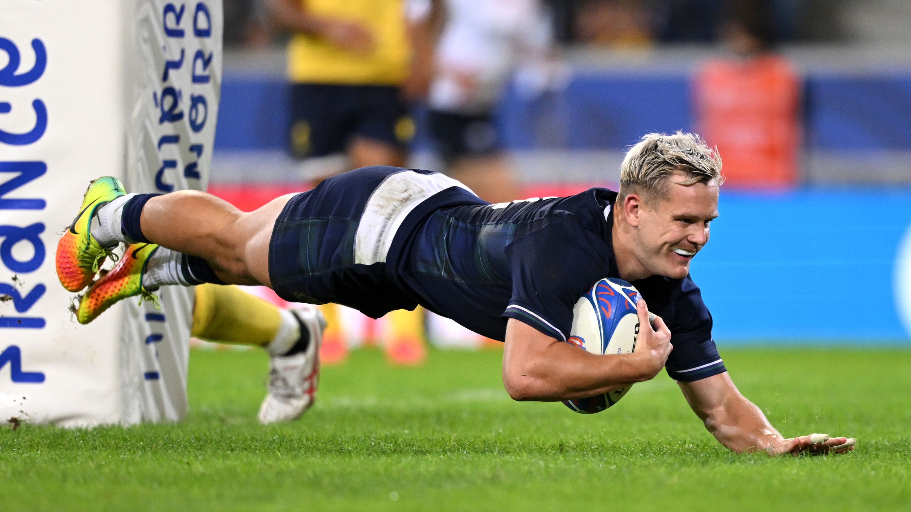 Darcy Graham of Scotland scores the team&#x27;s 12th try during the Rugby World Cup match against Romania.