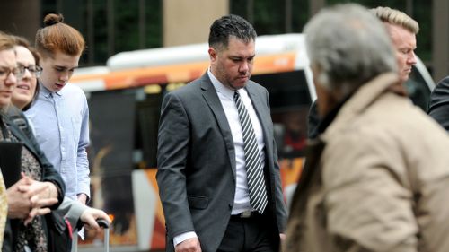 Jon Walker (centre), the father of Jaiden Walker arrives at the plea hearing for Richard Vincec at the Supreme Court in Melbourne.