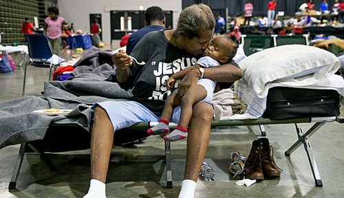 A child is comforted in the aftermath. 