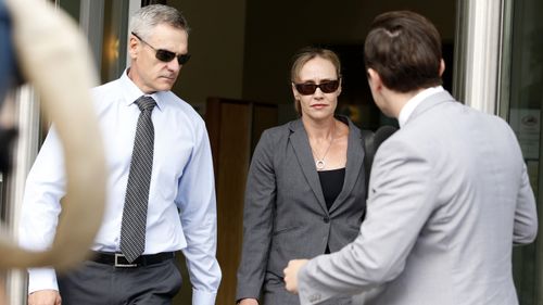  Senior Gold Coast police officer, Superintendent Michelle Stenner (centre), exits the Roma Street Magistrates Court in Brisbane. (AAP)