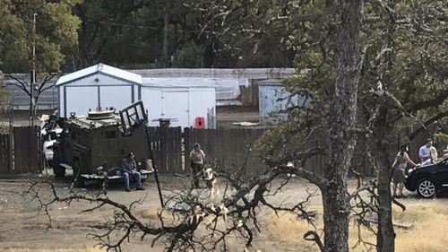 Residents and emergency personnel work at the scene of the mass shooting at Rancho Tehama in northern California. (AAP)