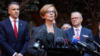 Julia Gillard speaks at a press conference in Boothby, flanked by Peter Malinauskas and Anthony Albanese.