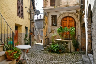 Maenza, Italy. A small street between the old stone houses of a medieval village in the province of Latina.