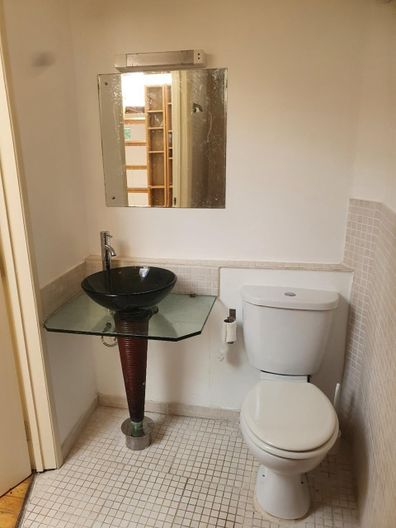A London flat on offer for just over $2k-a-month contains a rather unusual layout with a kitchen 'in a cupboard'.