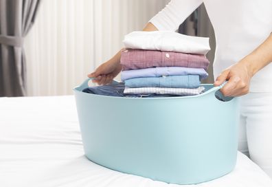 Folded clothes in a laundry basket