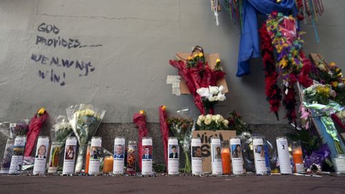 A memorial for the victims of a deadly truck attack on New Year's Day stands on the sidewalk in the French Quarter of New Orleans.