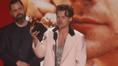 Harry Styles accepts his Grammy at the Grammys 2023