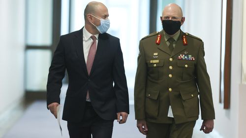 Treasurer Josh Frydenberg and COVID-19 Taskforce Commander, Lieutenant General John Frewen arrive for their press conference at Parliament House today.