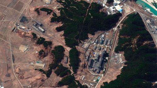 A satellite image taken in March 2021 and provided by Maxar Technologies shows a steam plant, left, and North Korea's main atomic complex, right, in Yongbyon, North Korea. Smoke was observed emanating from the plant's smokestack.