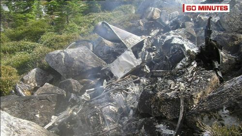 The pilot's helicopter was completely destroyed in the inferno on a Canadian hillside. (60 Minutes)