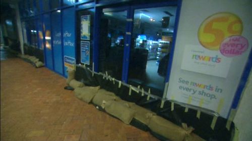 Sandbags line buildings along Yeppoon's streets in preparation for flooding. (9NEWS)