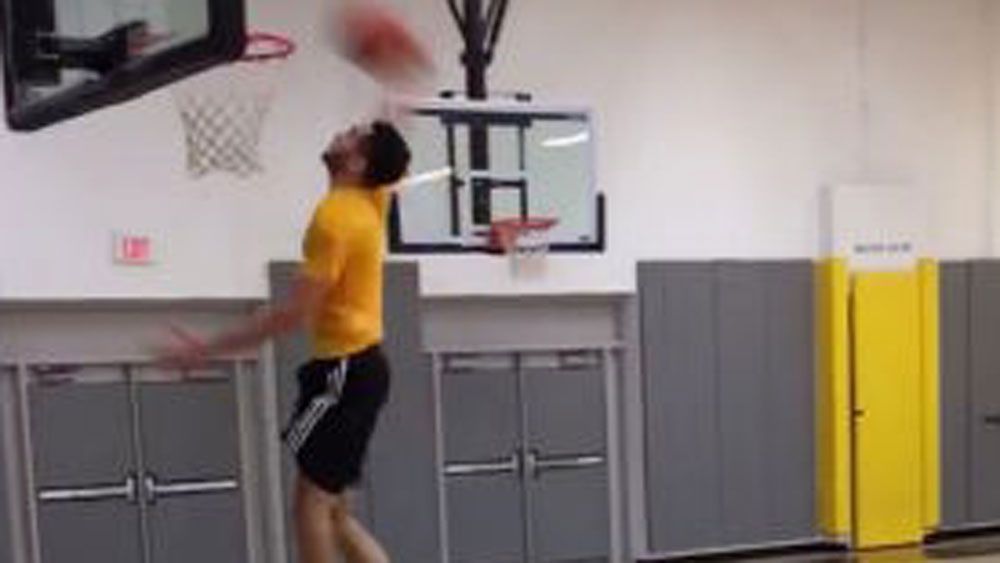 Missed dunk turns into trick shot