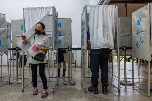 People vote in local elections amid tensions with China on November 26, 2022 in Taipei, Taiwan.