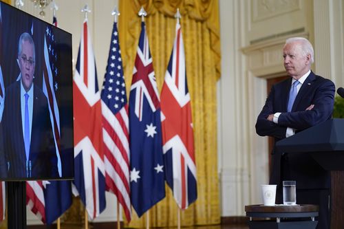 President Joe Biden, listens as he is joined virtually by Australian Prime Minister Scott Morrison and British Prime Minister Boris Johnson, not seen, as he speaks about a national security initiative from the East Room of the White House in Washington.