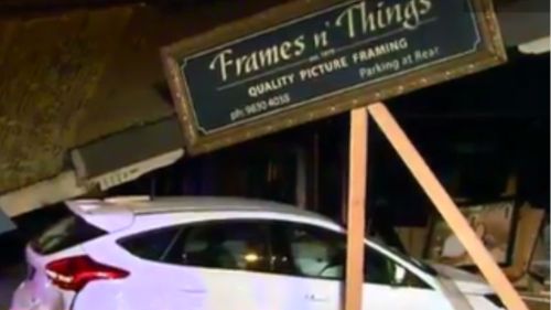 The store and the car sustained significant damage. (9NEWS)