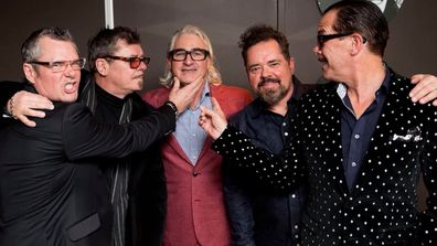 Chris Murphy with INXS band members