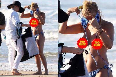 Lara Bingle showed off her toned body - and a whole lot more - on a recent photo shoot for her new 'Lara Bingle for Cotton On Body' swimwear line. Cavorting around on the beach in Noosa, on Queensland's Sunshine Coast, Lara let it all hang out as she got changed in front of the crew. Go, Lara!