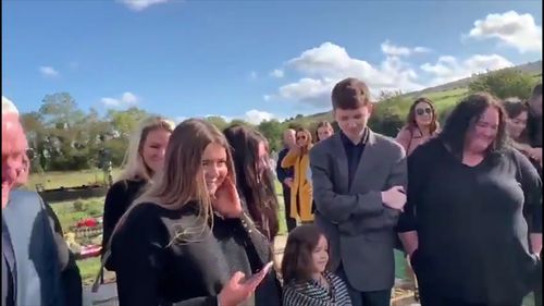 Shay Bradley's daughter Andrea and her siblings granted his final wish by playing a recording of his voice coming from his coffin as it was lowered.