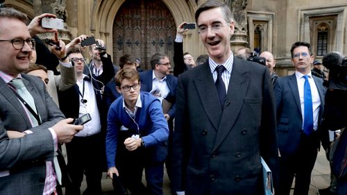 Leading Brexiteer Jacob Rees-Mogg addresses a media scrum after submitting a letter of no confidence in Theresa May.