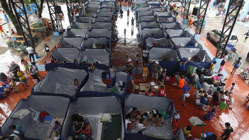 Some 105,000 people were staying in temporary shelters after mass evacuation of coastal areas following major storm surge warnings