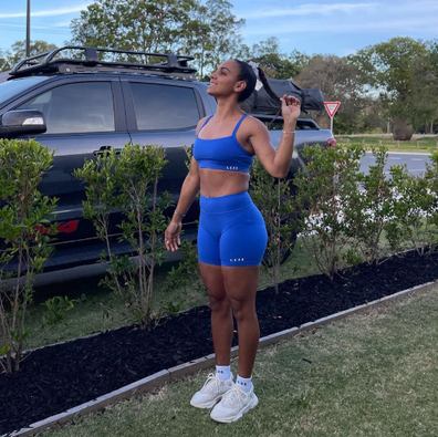 Courtney Hodder poses in blue activewear