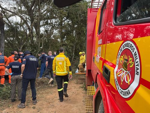Emergency services operate at the area where a hot air balloon crashed, leaving at least 8 dead in Santa Catarina, Brazil on June 21, 2025.