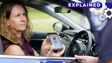 A woman using Queensland&#x27;s new digital licence