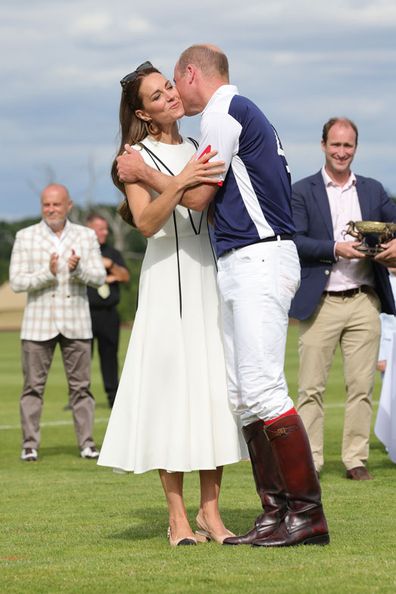 Prince William, Duke of Cambridge gives wife Catherine, Duchess of Cambridge a kiss on the cheek after the Royal Charity Polo Cup 2022 at Guards Polo Club 