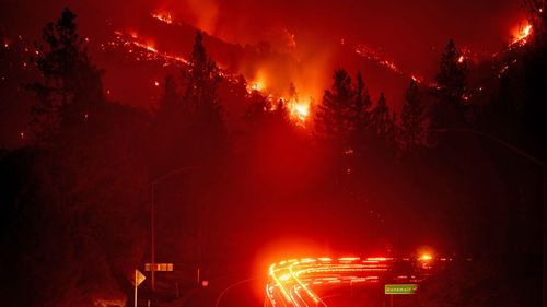 Hillsides were consumed by flames as wildfires spread through California. 